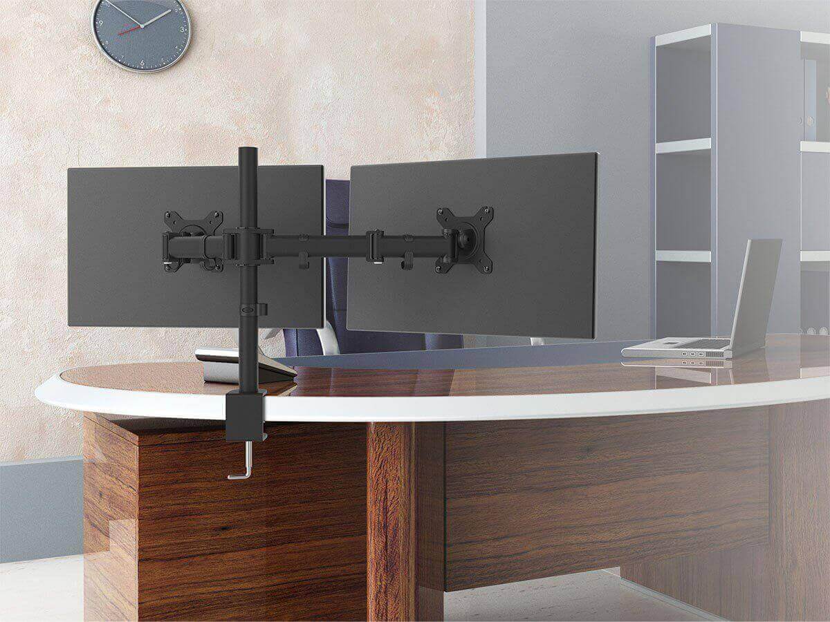 Essential Dual Monitor Arm Desk Mount holding two monitors above a modern office desk.