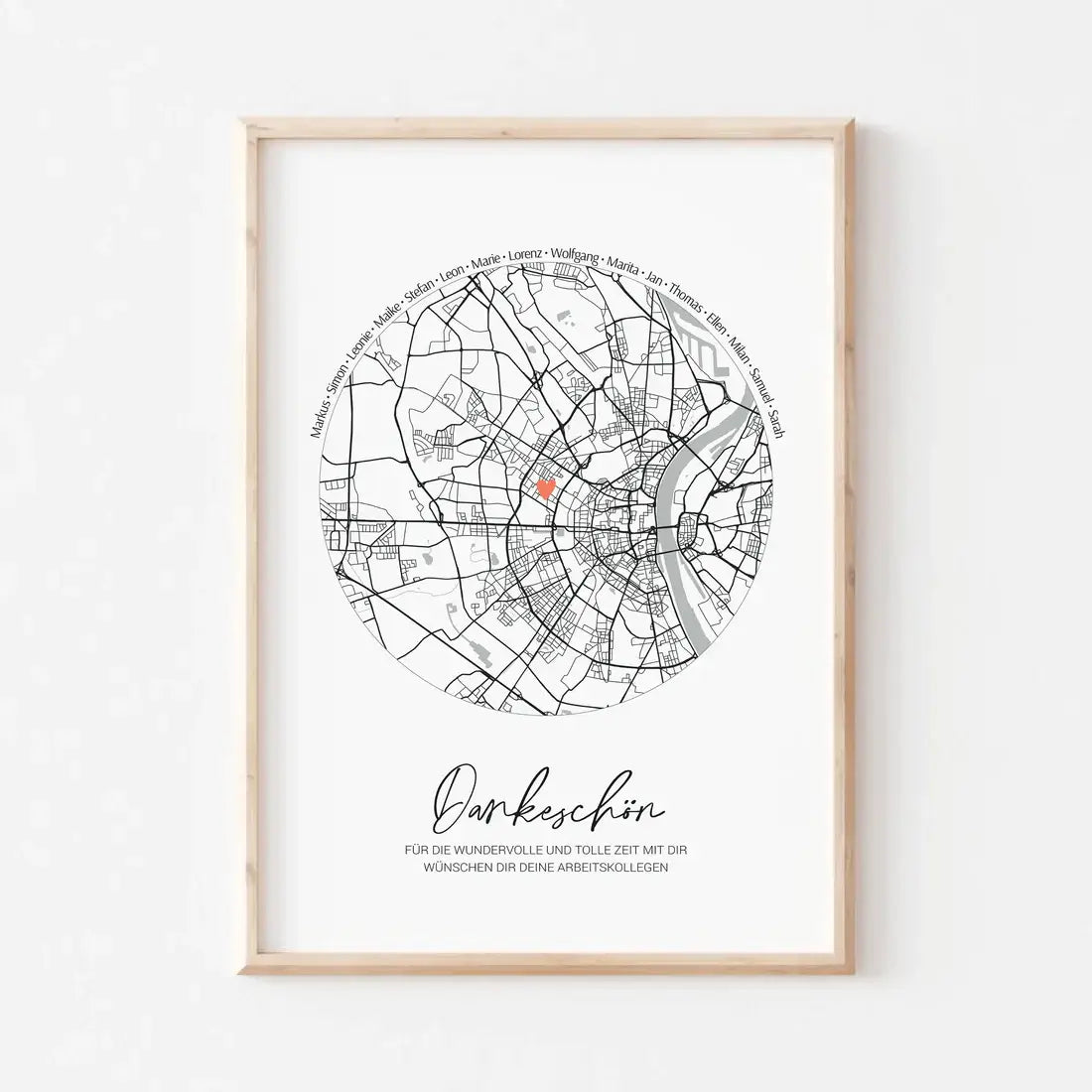 Framed map print featuring a circular design with the text 'Dankeschön' in German, elegantly displayed on a white wall.
