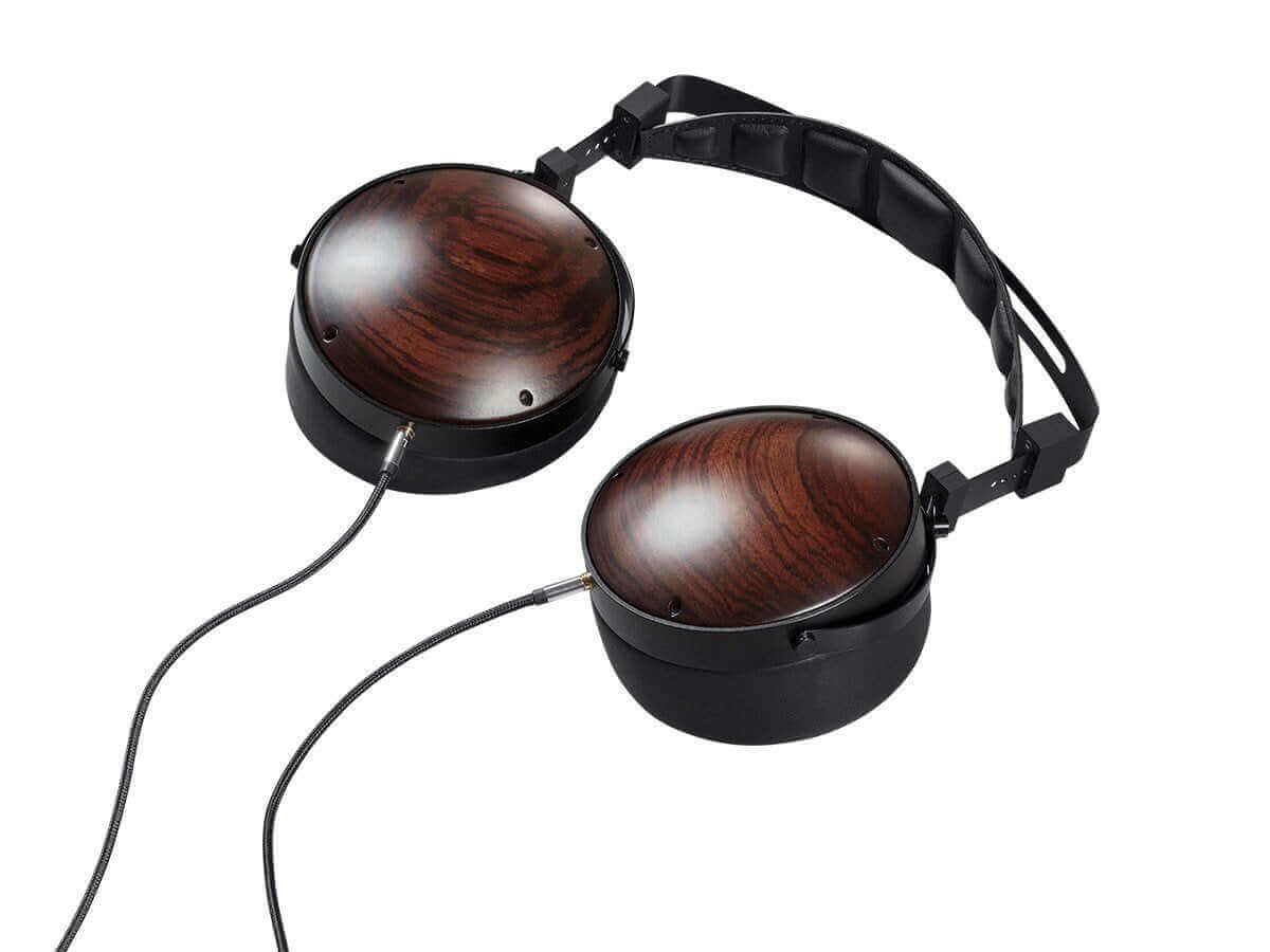 Monolith M1060C planar headphones with redesigned planar driver, closed back enclosure, and polished wood finish.